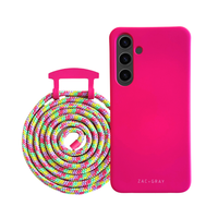 a pink phone case next to a colorful rope