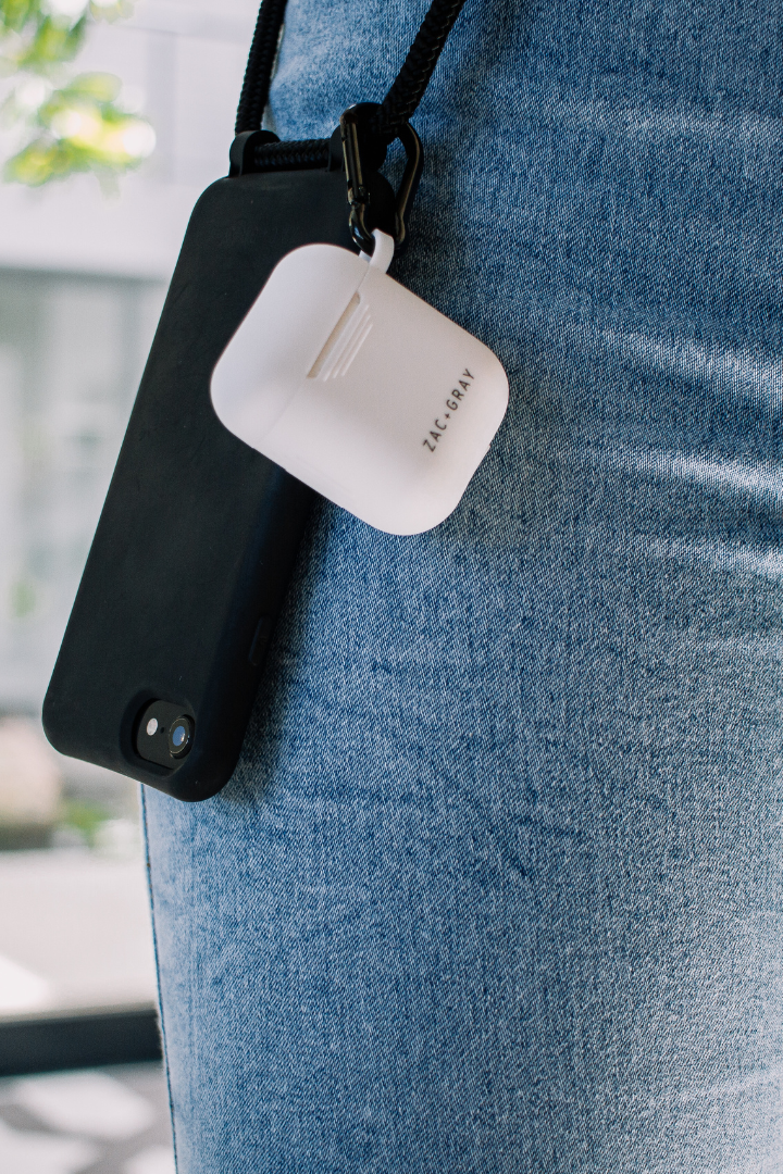 a cell phone attached to a black and white case