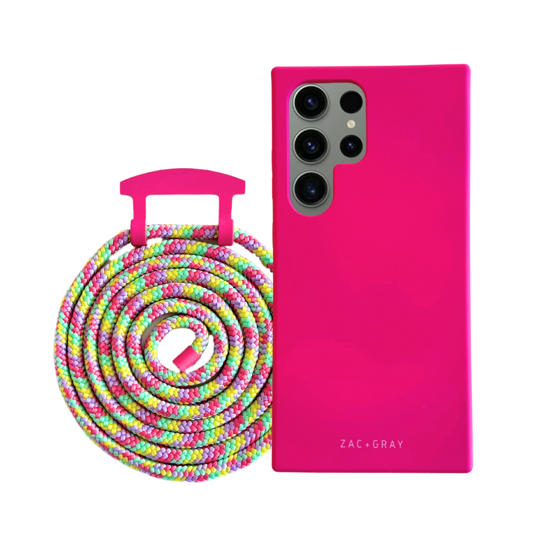 a pink phone case next to a colorful cable